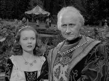 Movie still from “Prince of Foxes” (1949), directed by Henry King – An older man and woman dressed in medieval garb; Medium shot, Low angle