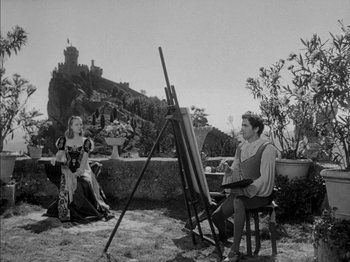 Movie still from “Prince of Foxes” (1949), directed by Henry King – Two people sitting in front of an easel in a garden; Wide shot, High angle