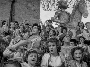 Movie still from “Prince of Foxes” (1949), directed by Henry King – A group of people standing in a crowd; Wide shot, High angle