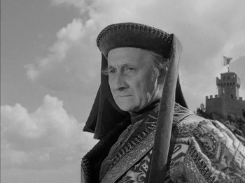 Movie still from “Prince of Foxes” (1949), directed by Henry King – An old man wearing a hat and holding a sword; Close Up shot, Low angle