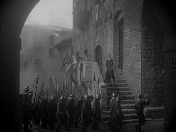Movie still from “Prince of Foxes” (1949), directed by Henry King – A black and white photo of a medieval scene; Wide shot, High angle
