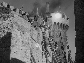 Movie still from “Prince of Foxes” (1949), directed by Henry King – A black - and - white photo of a medieval castle; Extreme Wide shot, Low angle