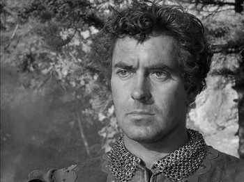 Movie still from “Prince of Foxes” (1949), directed by Henry King – Black and white photograph of a man in a chain mail outfit; Close Up shot, Low angle