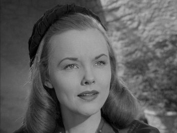 Movie still from “Prince of Foxes” (1949), directed by Henry King – An old photo of a woman wearing a hat; Close Up shot, Low angle
