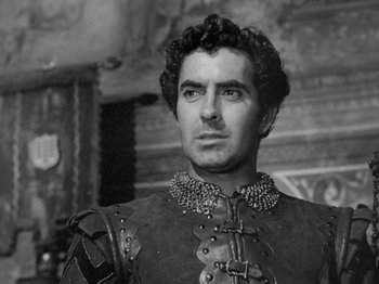 Movie still from “Prince of Foxes” (1949), directed by Henry King – Black and white photograph of a man wearing a suit of armor; Close Up shot, Low angle