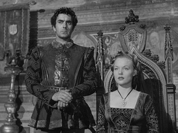 Movie still from “Prince of Foxes” (1949), directed by Henry King – A black and white photo of a man and a woman; Medium shot, Low angle