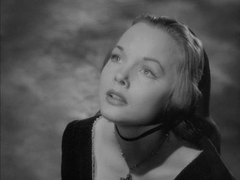 Movie still from “Prince of Foxes” (1949), directed by Henry King – A black - and - white photo of a young woman; Close Up shot, Low angle
