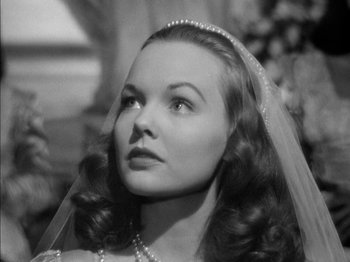 Movie still from “Prince of Foxes” (1949), directed by Henry King – A black - and - white photo of a woman wearing a veil; Close Up shot, Low angle