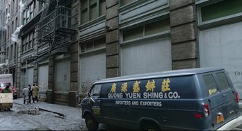 Movie still from “Prince of the City” (1981), directed by Sidney Lumet – A van parked on the side of the road in front of a building; Wide shot, Low angle