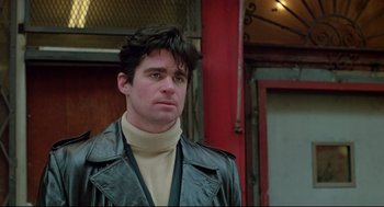 Movie still from “Prince of the City” (1981), directed by Sidney Lumet – A man wearing a leather jacket and a sweater; Close Up shot, Low angle
