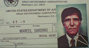 Movie still from “Prince of the City” (1981), directed by Sidney Lumet – An old photo of a man in a police department uniform; Extreme Close Up shot, Overhead angle