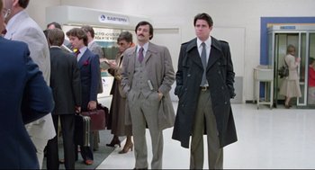 Movie still from “Prince of the City” (1981), directed by Sidney Lumet – A group of men standing next to each other in a room; Wide shot, Low angle