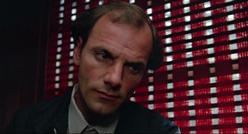 Movie still from “Prince of the City” (1981), directed by Sidney Lumet – A person wearing a suit and tie; Close Up shot, Low angle