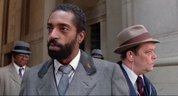 Movie still from “Prince of the City” (1981), directed by Sidney Lumet – A man in a suit and a tie; Close Up shot, Low angle
