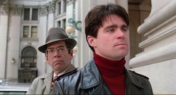 Movie still from “Prince of the City” (1981), directed by Sidney Lumet – A man in a hat and a man in a jacket and a hat; Close Up shot, Low angle