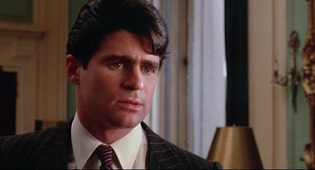 Movie still from “Prince of the City” (1981), directed by Sidney Lumet – A person wearing a suit and tie; Close Up shot, Low angle