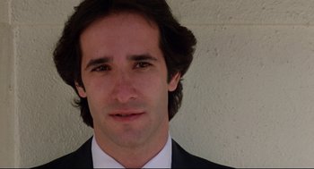 Movie still from “Prince of the City” (1981), directed by Sidney Lumet – A person wearing a suit and tie; Close Up shot, Low angle