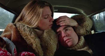 Movie still from “Prince of the City” (1981), directed by Sidney Lumet – A man and a woman laying in the back of a car; Close Up shot, Low angle