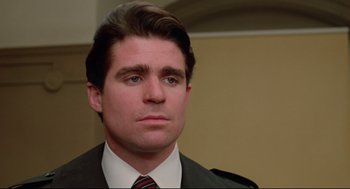 Movie still from “Prince of the City” (1981), directed by Sidney Lumet – A person wearing a suit and tie; Close Up shot, Low angle