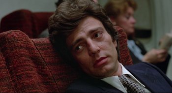 Movie still from “Prince of the City” (1981), directed by Sidney Lumet – A person wearing a suit and tie; Close Up shot, Low angle
