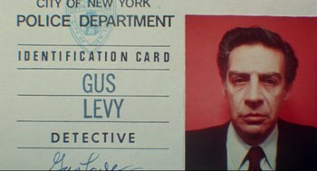 Movie still from “Prince of the City” (1981), directed by Sidney Lumet – A new york department identification card; Close Up shot, Low angle