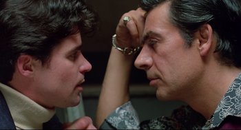 Movie still from “Prince of the City” (1981), directed by Sidney Lumet – A man and a woman face each other with handcuffs; Close Up shot, Over the shoulder angle