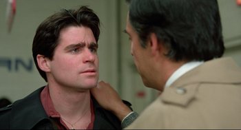 Movie still from “Prince of the City” (1981), directed by Sidney Lumet – A man is looking at another man with a hand on his shoulder; Close Up shot, Over the shoulder angle