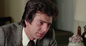 Movie still from “Prince of the City” (1981), directed by Sidney Lumet – A person wearing a suit and tie; Close Up shot, Low angle