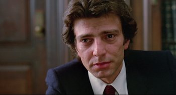 Movie still from “Prince of the City” (1981), directed by Sidney Lumet – A person wearing a suit and tie; Close Up shot, Low angle