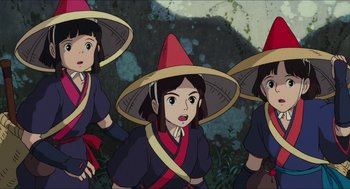 Movie still from “Princess Mononoke” (1997), directed by Hayao Miyazaki – A group of three women wearing hats in front of a forest; Close Up shot, High angle