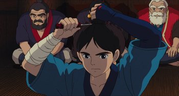 Movie still from “Princess Mononoke” (1997), directed by Hayao Miyazaki – A man is cutting another man's hair with a pair of shears; Close Up shot, Over the shoulder angle