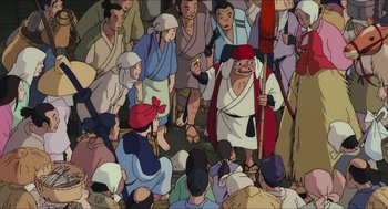 Movie still from “Princess Mononoke” (1997), directed by Hayao Miyazaki – A group of people gathered around a man holding a spear; Wide shot, High angle