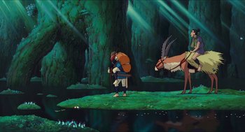 Movie still from “Princess Mononoke” (1997), directed by Hayao Miyazaki – An animated scene of a man with a bag on his back and an animal on his back; Wide shot, High angle
