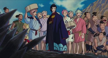 Movie still from “Princess Mononoke” (1997), directed by Hayao Miyazaki – A group of people standing in front of an animated character; Wide shot, Low angle