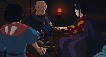 Movie still from “Princess Mononoke” (1997), directed by Hayao Miyazaki – An animated scene of a man and a woman in a room; Medium shot, Over the shoulder angle