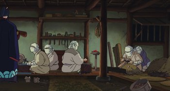 Movie still from “Princess Mononoke” (1997), directed by Hayao Miyazaki – A group of people sitting around in a room; Wide shot, Low angle