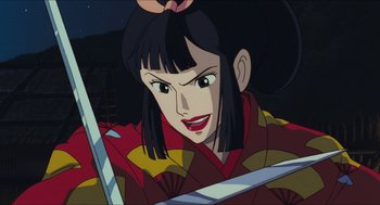 Movie still from “Princess Mononoke” (1997), directed by Hayao Miyazaki – A person holding a sword in their hands; Close Up shot, Low angle