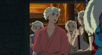 Movie still from “Princess Mononoke” (1997), directed by Hayao Miyazaki – A group of people standing next to each other in a room; Close Up shot, High angle