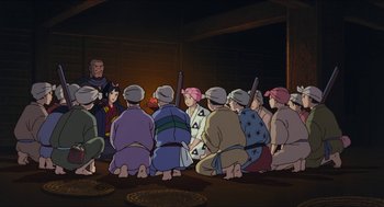 Movie still from “Princess Mononoke” (1997), directed by Hayao Miyazaki – A group of people sitting in front of an audience; Wide shot, High angle