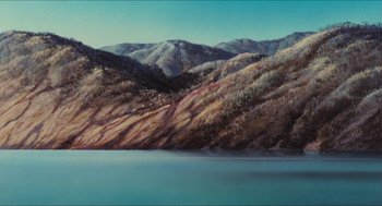 Movie still from “Princess Mononoke” (1997), directed by Hayao Miyazaki – A painting of a lake and mountains in the background; Extreme Wide shot, High angle