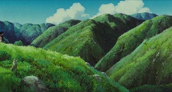 Movie still from “Princess Mononoke” (1997), directed by Hayao Miyazaki – A painting of a green hilly area with a sky background; Extreme Wide shot, Low angle
