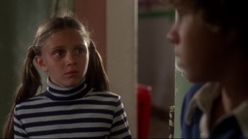 Movie still from “Prom Night” (1980), directed by Paul Lynch – A young girl in a striped shirt looking at a young man in a striped shirt; Close Up shot, Over the shoulder angle