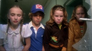 Movie still from “Prom Night” (1980), directed by Paul Lynch – A group of young people standing next to each other; Medium shot, Low angle