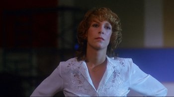 Movie still from “Prom Night” (1980), directed by Paul Lynch – A person wearing a white shirt; Close Up shot, Low angle