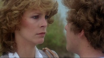 Movie still from “Prom Night” (1980), directed by Paul Lynch – A woman and a man face to face in a scene; Close Up shot, Over the shoulder angle