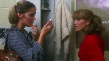 Movie still from “Prom Night” (1980), directed by Paul Lynch – Two women are looking at each other in the mirror; Close Up shot, Low angle