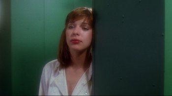 Movie still from “Prom Night” (1980), directed by Paul Lynch – A woman standing in front of a green wall; Close Up shot, Low angle