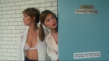 Movie still from “Prom Night” (1980), directed by Paul Lynch – Two young women standing next to each other in front of a brick wall; Medium shot, Low angle