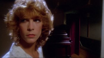 Movie still from “Prom Night” (1980), directed by Paul Lynch – A woman's face in front of a piano; Close Up shot, Low angle