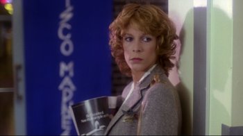 Movie still from “Prom Night” (1980), directed by Paul Lynch – A woman holding a coffee cup in her hands; Medium shot, Low angle